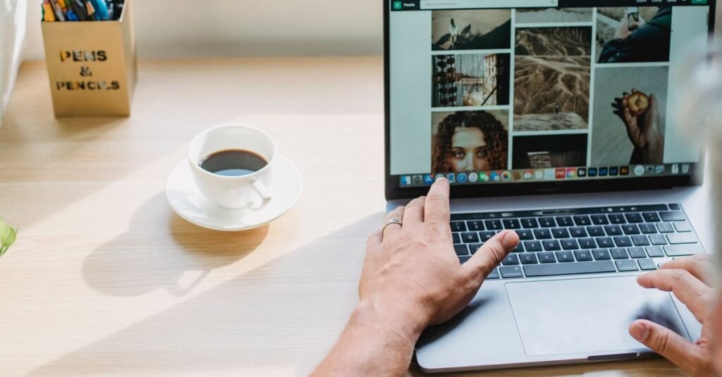 Website designer selecting visual assets on a laptop