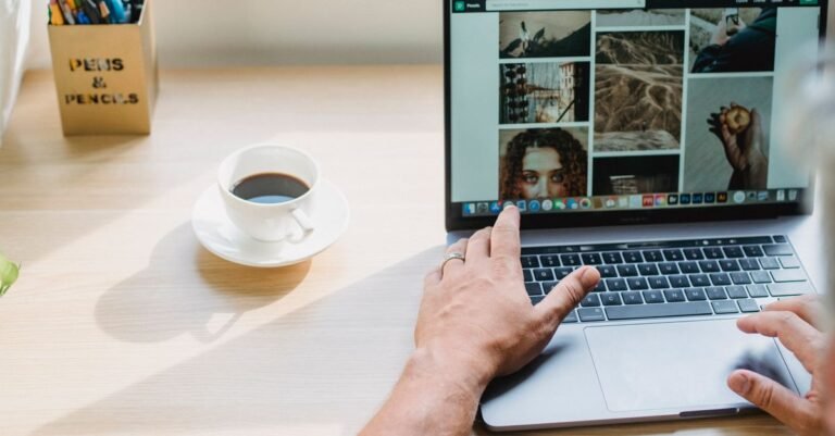 Website designer selecting visual assets on a laptop