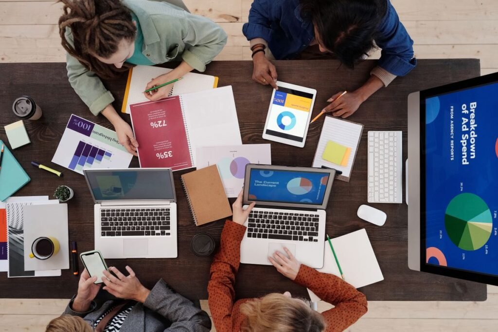 Team reviewing marketing research and charts at a desk